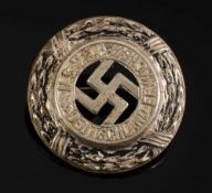 An NSDAP silver plated 'Deutschland Erwache' badge:, unmarked 2.3cm diameter.