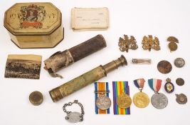 A WWI pair together with a collection of buttons, cap badges and commemorative medals:,