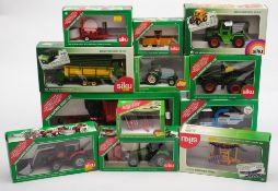 A collection of Siku 1/32 scale farm series vehicles:, including a sugar beet harvester,