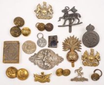 A collection of WWI and later cap badges and buttons:,