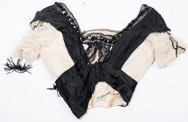 An early 20th century lady's black and white silk blouse:,
