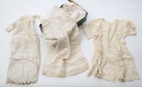A collection of five early 20th century baby's christening gowns/ white ware:.