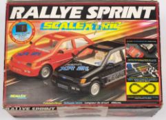 A Scalextrix C807 'Super Rallye Sprint Set':, figure of eight track and two Ford XR2i cars,