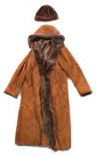 A late 20th century tan coloured suede sheepskin coat by Topa & Topa:, tother with matching hat.