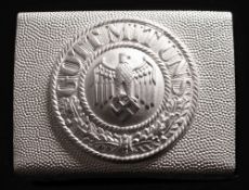 A Wermacht enlisted pattern belt buckle:, inscribed 'Gott Mit Uns', unsigned.