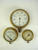 A 7 inch brass bulkhead Combined Pressure and Vacuum gauge by J Tomey & Sons, Birmingham,