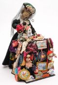 A 20th century peddler doll:, of traditional form,