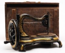 A Victorian 'Jones Hand Machine' black lacquer sewing machine:,