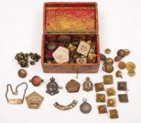 A collection of various WWI & WWII buttons, badges, and shoulder flashes etc:.