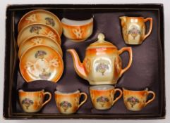 A 1930s period child's lustre ware tea set.