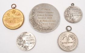 Three Edwardian running medallions to H M Haslehurst, together with two later sporting medallions:,