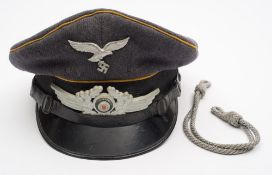 A Luftwaffe Flight Section peaked cap:, with yellow piping,