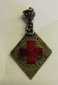An Imperial Russian silver and enamel Imperial Red Cross badge: inscribed and dated to the reverse