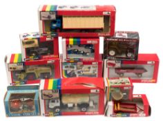 A collection of Britains1/32 scale farm series vehicles:, including a Klaus Forage harvester,