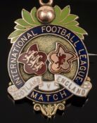 A 9ct gold and enamel International Football League medal awarded to Alexander 'Alex' Bennett,