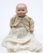 An Armand Marseille bisque head baby doll:, with moulded hair,