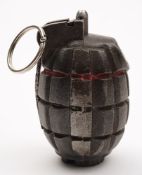 A de-activated Model 36 Mills hand grenade:.