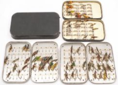 Two aluminium fly tins together with two lacquer fly tins and a collection of gut and steel eye
