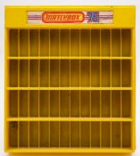 A Matchbox 75 moulded yellow plastic shop display unit: 59 x 53cm.
