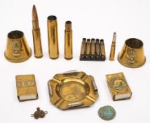 A collection of various trench art matchbox holders, ashtrays and shell casings:.