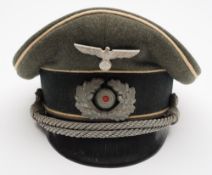A German Army Infantry Officer's peaked cap:, with pressed eagle and oak leaf cockade,