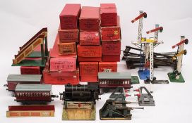 A collection of Post-War Hornby O gauge railway and rolling stock:, including a level crossing,