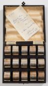 A cased set of fifteen silver napkin rings engraved with the badge for RAF Squadron 906:,