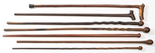 Four early 20th century lignum walking canes and three other various canes:, (4).