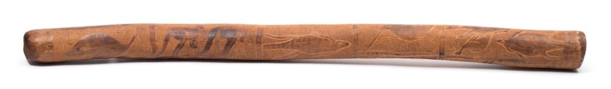 A didgeridoo:, of traditional form with chop carved emu and kangaroo decoration, 93cm long.