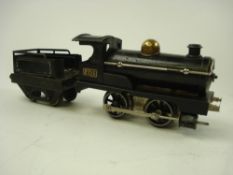 Hornby clockwork 0-4-0 LMS locomotive and tender 2710:, with brass number plaque to cab.