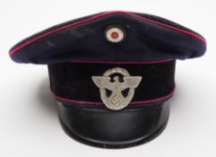 A German Fire Police peaked cap:,