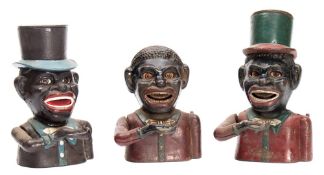 Three cast iron money banks:, two wearing top hats:,