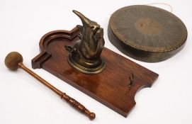 A bronzed rhino head hunting trophy dinner gong on oak mount by William Tonks & Son, Birmingham:,