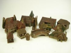 An early 20th century painted wood model village:, comprising church, cottages, windmill,