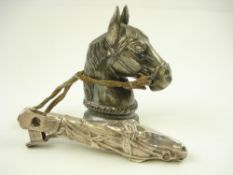 A Continental silver plated table lighter in the form of a horse's head,