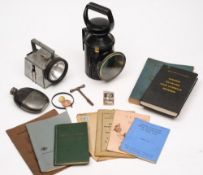 A BR tri-colour signal lamp together with a later BR battery version and a quantity of BR handbooks