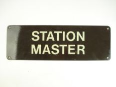A brown and cream enamel 'Station Master' sign:, 15.2cm x 45.6cm.