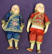 A late 19th century Chinese embroidered panel depicting temple lions amongst foliage and with eight