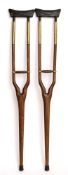 A pair of 19th century teak and brass mounted auxillary crutches:,