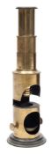 A 19th century brass monocular student microscope:, unsigned in a fitted mahogany case.
