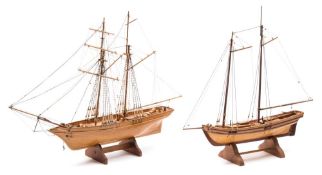 A scale model of a gaff and another of a schooner:, the former with plank and pinned hull,