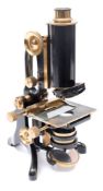 A lacquered brass microscope by C Baker, London:,