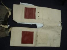 A pair of 'Navy Seascape' chafing pants and one other pair of chafing pants:.