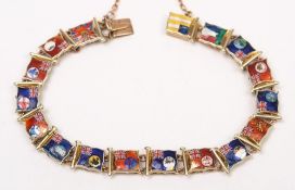 An enamelled bracelet with seventeen Merchant Navy flag panels:,