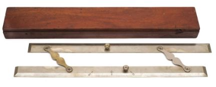 A polished steel parallel rule in mahogany case:, of traditional form with moustache hinges,