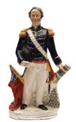 A Staffordshire pottery portrait figure of Admiral Sir Deans Dundas: modelled standing in naval