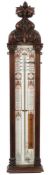 An Edwardian 'Admiral Fitzroy' pattern barometer in an oak Gothic carved case:,
