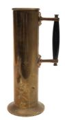 A ship's engine room brass jug:, of plain cylindrical form with ebonised handle and flared foot,