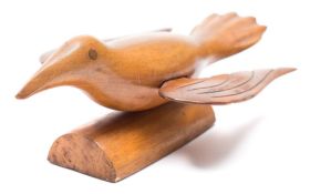 A Pitcairn Island carved wood bird:, stamped 'A souvenir form Pitcairn,