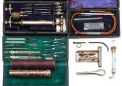 A silver plated syringe by Evans & Sons , London in a fitted case with needles,